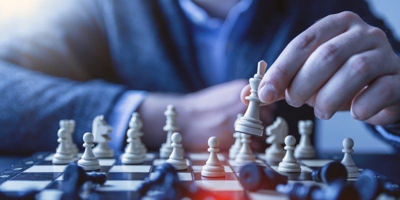 businessman playing chess