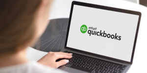 Woman viewing QuickBooks on her laptop