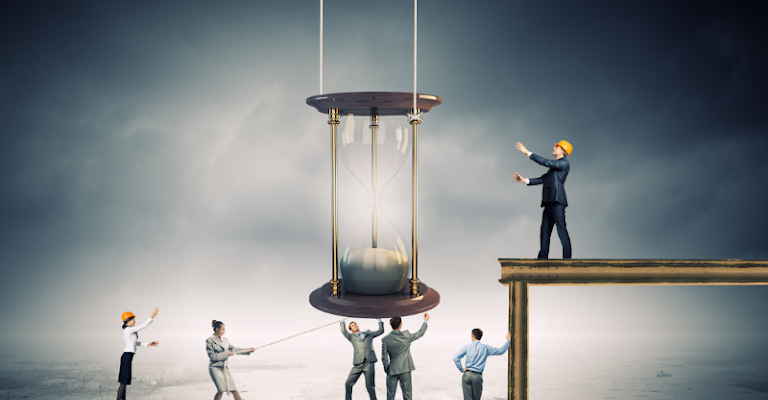 The concept of time tracking, depicted by business people collaborating to raise an hourglass.