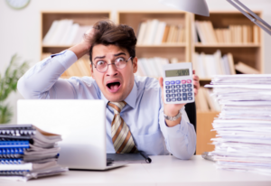A panicked business owner taking on a bookkeeper role.